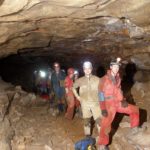 A line of cavers and gear head down Arlie Way - Photo: Brian Williams A line of cavers and gear head down Arlie Way - Photo: Brian Williams