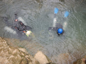 Divers Mark Wenner and Marbry Hardin enter Echo Spring. Photos by Rick Toomey or Rick Olson.